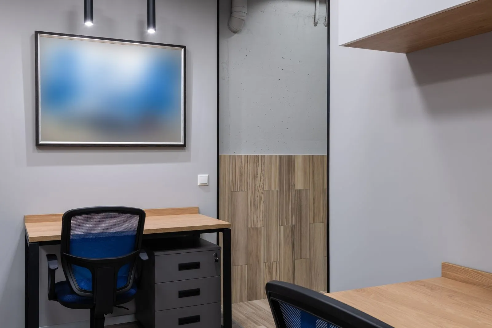 Sleek and contemporary office space with minimalist design elements, perfect for work efficiency.